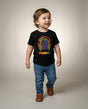 Toddler in the HUMAN Pride tee, full-body editorial