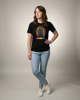 Woman in the HUMAN Pride tee, full-body editorial