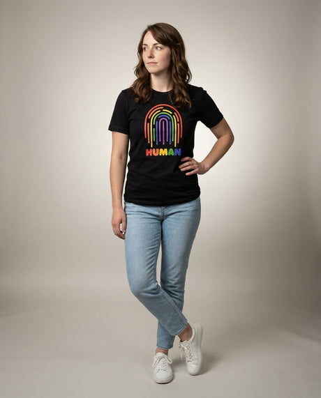 Woman in the HUMAN Pride tee, full-body editorial