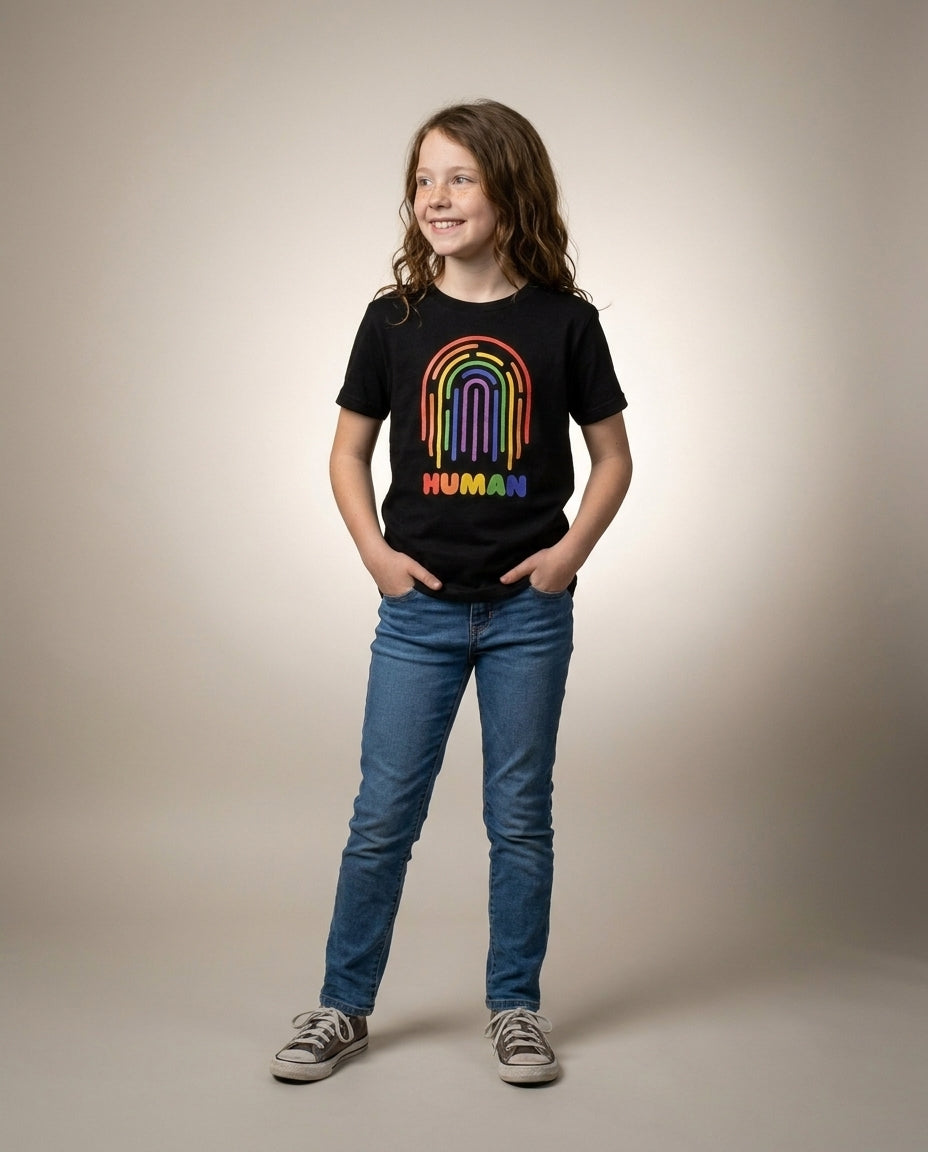 Youth in the HUMAN Pride tee, full-body editorial